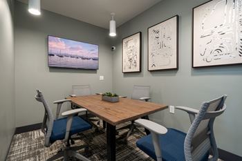 Resident Working Space With Mounted Flat Screen TV